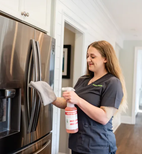 Team Member Cleaning Fridge