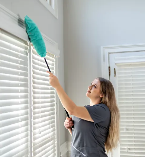 Team Member Cleaning Window