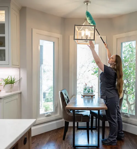 Team Member Cleaning Lights