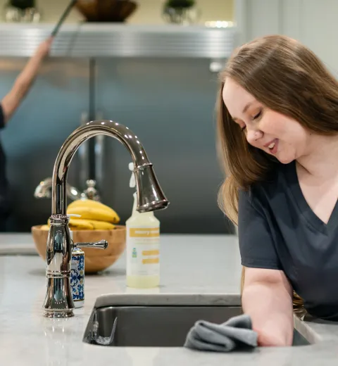 Team Members cleaning kitchen