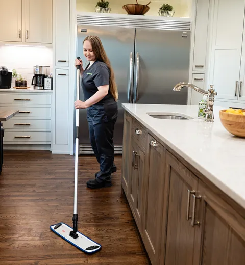 Team Member Mopping Floor