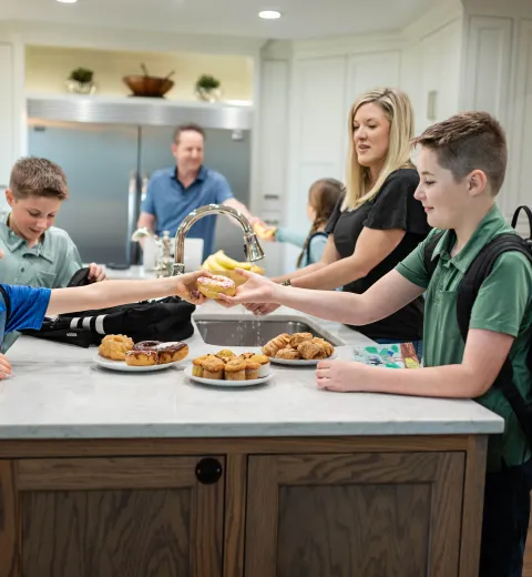 Family getting ready for school in a clean kitchen