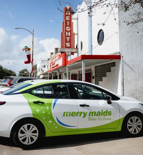 merry maids branded vehicle parked downtown