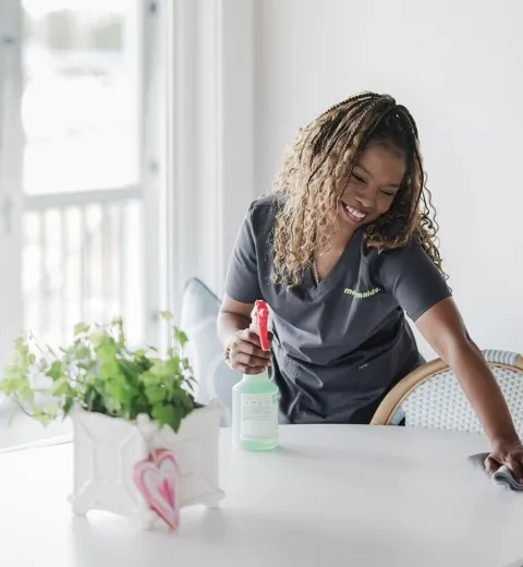 Merry Maid cleaning kitchen table