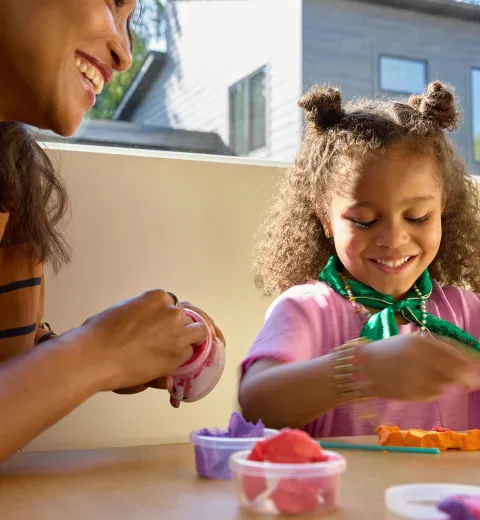 mom and little girl crafting