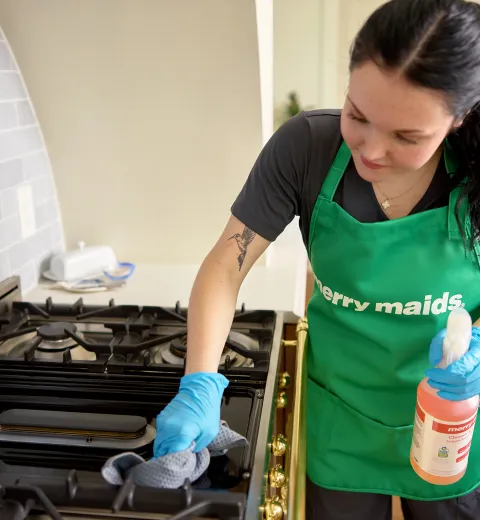 merry maid cleaning kitchen stove