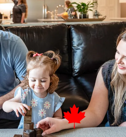 Family Playing Games with Canadian Maple Leaf