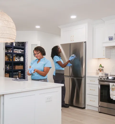 Merry Maids cleaning a kitchen