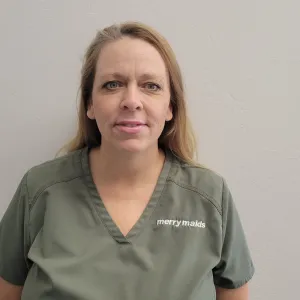 Blonde woman in Merry Maids uniform