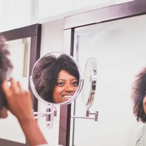 Woman putting on makeup