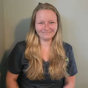 woman with long blonde hair wearing a merry maids uniform