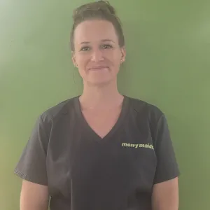 Lauren standing in front of a green wall