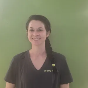 Emily in front of a green wall