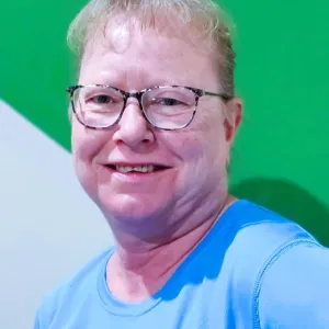 merry maid smiling wearing a blue uniform