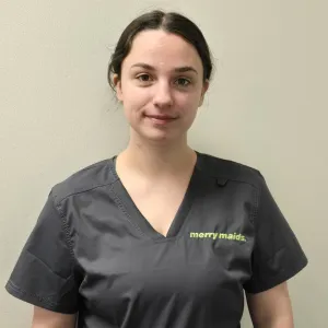 merry maid wearing a tan uniform