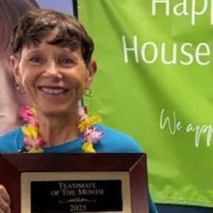 woman holding up a plaque