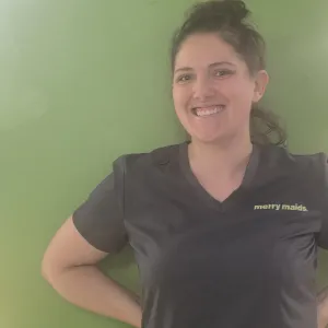 Kathryn standing in front of a green wall