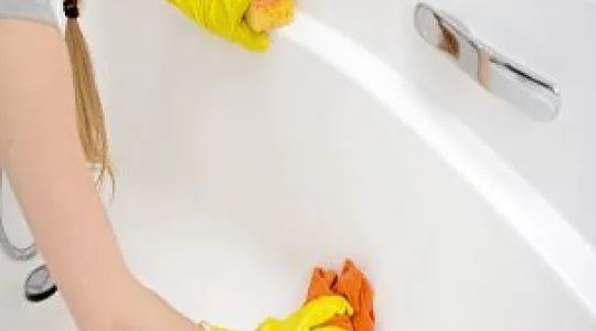 Scrubbing a bathtub clean