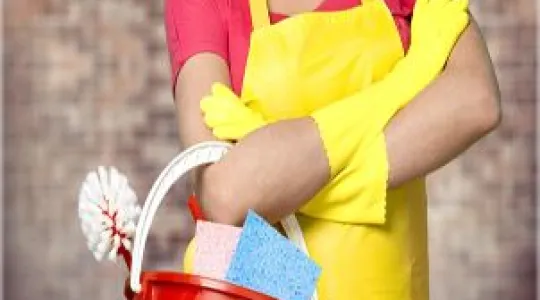 Woman with cleaning supplies