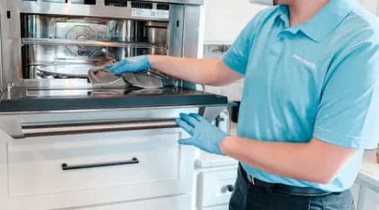 Merry Maid Cleaning an oven