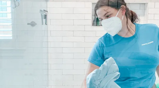 Merry Maid Cleaning Shower.