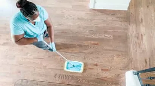 Team Member Sweeping Floor