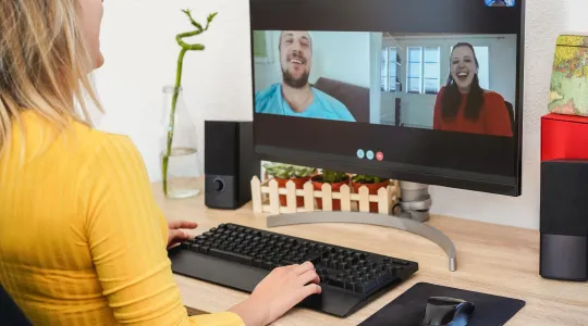 Young woman having a video call with friends during isolation quarantine.