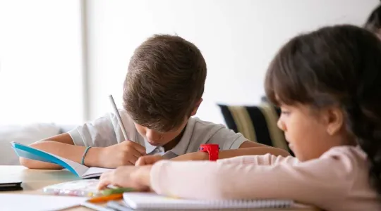 Kids completing schoolwork | Merry Maids