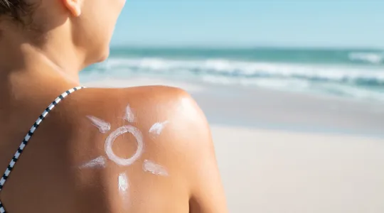Woman with sunscreen sun drawing on her shoulder | Merry Maids