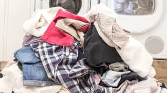 a giant pile of laundry on the floor