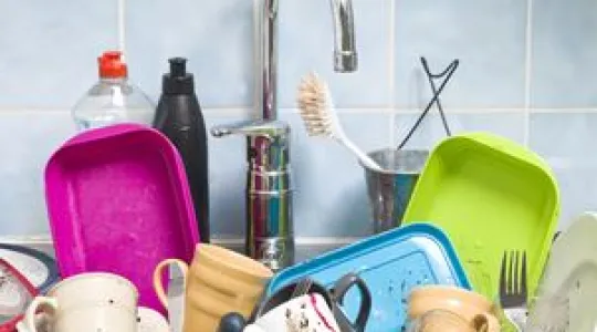 a sink full of filthy dishes
