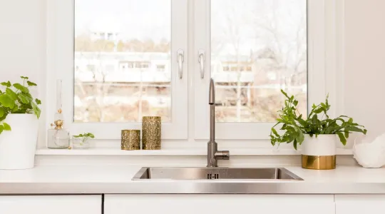 kitchen sink in front of sunny window