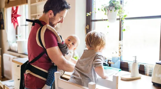 Dad and kids washing dishes in sink
