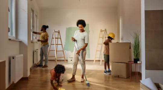 African American family cleaning their new home during renovations | Merry Maids