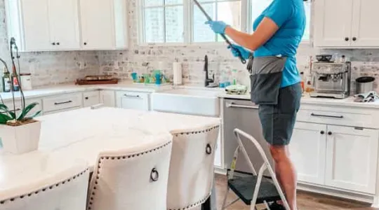 Woman cleaning the kitchen