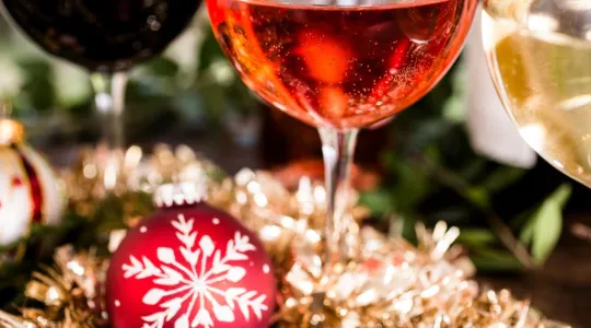 Wine glass in front of a Christmas tree |Merry Maids