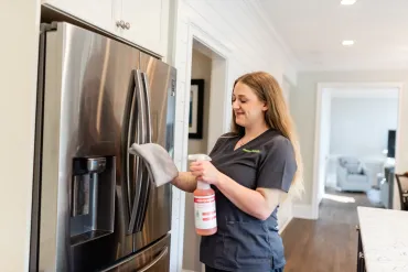 Team Member Cleaning Fridge
