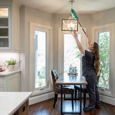 Team Member Cleaning Lights