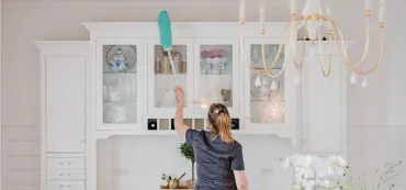 Team Member Cleaning Cabinets