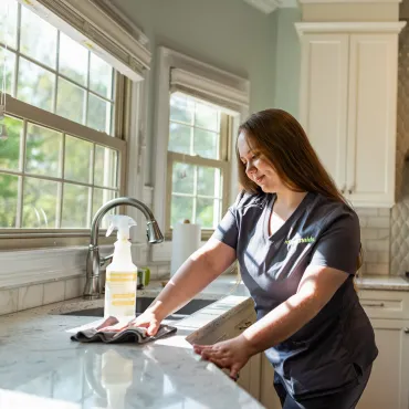 Team Member Cleaning Sink