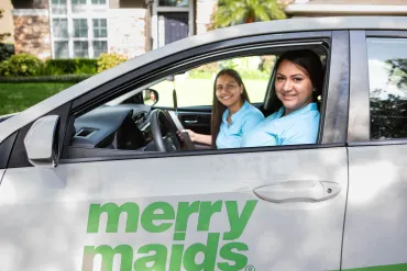 merry maids sitting in a branded vehicle