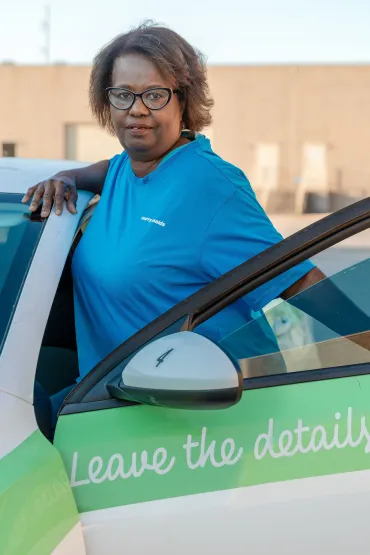 merry maid getting into a branded vehicle
