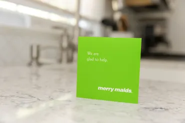green merry maids card on a kitchen countertop