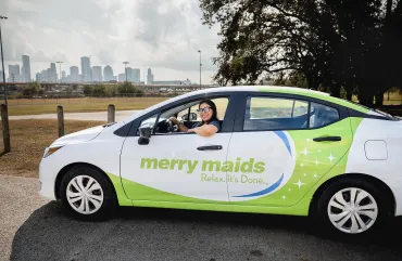 merry maid sitting in a branded vehicle