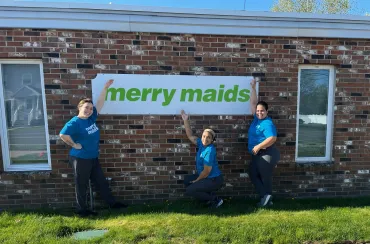 Merry Maids cleaning team standing outside their Bristol location