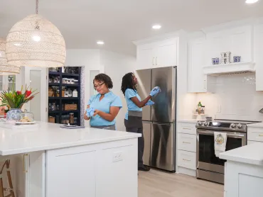 Merry Maids cleaning a kitchen