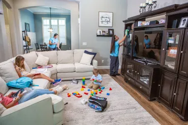 kids playing while Merry Maids clean