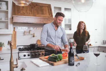 Husband and Wife Cooking Meal Together
